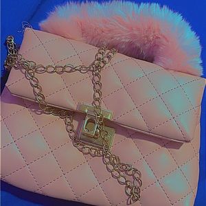 Pink mini bag with gold carry-over shoulder chain. The brand is from SHEIN